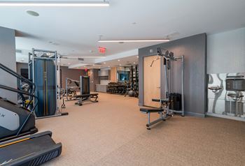 Health club with cardio and weight training equipment